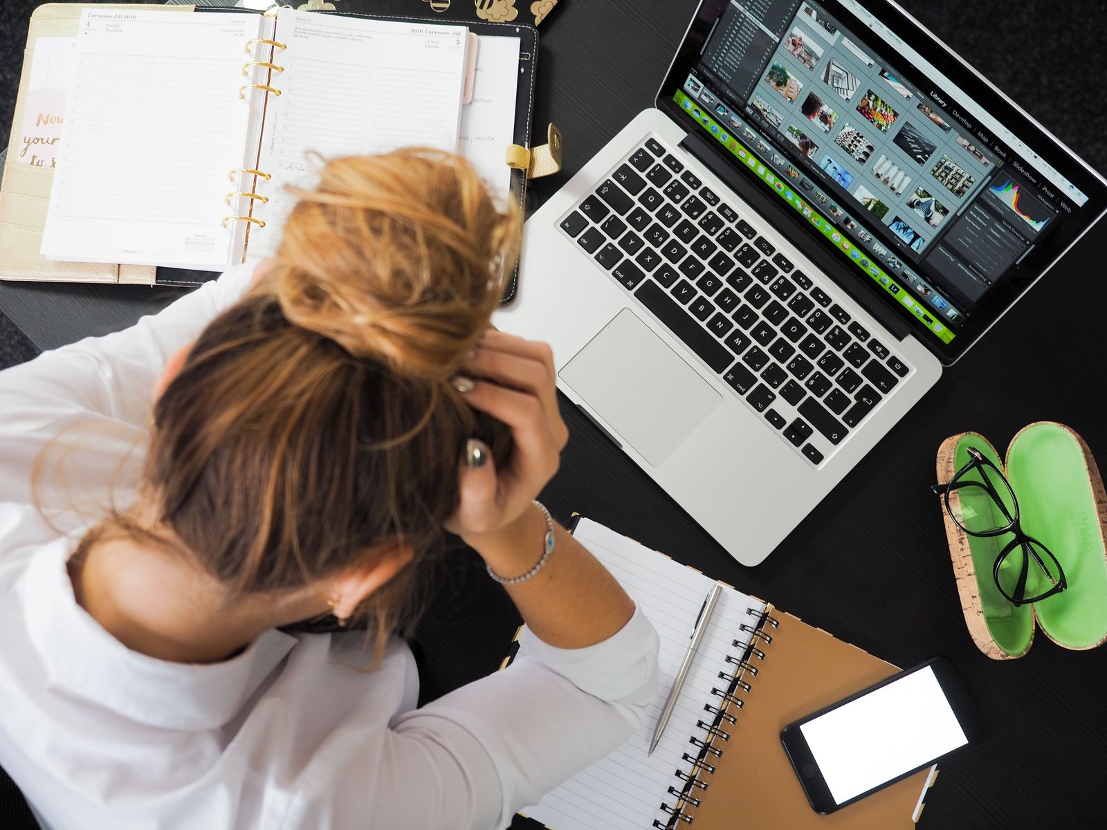 Frustrated business owner checking Google Ads clicks but no conversions on a laptop