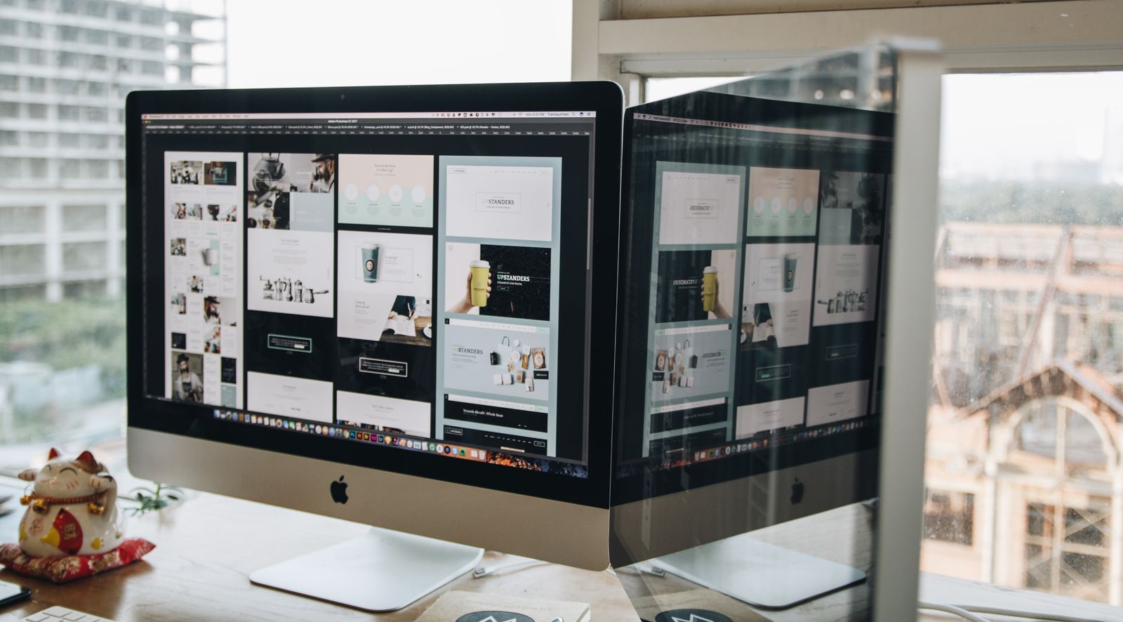 Marketer comparing website performance data on computer screens during a conversion rate optimization review