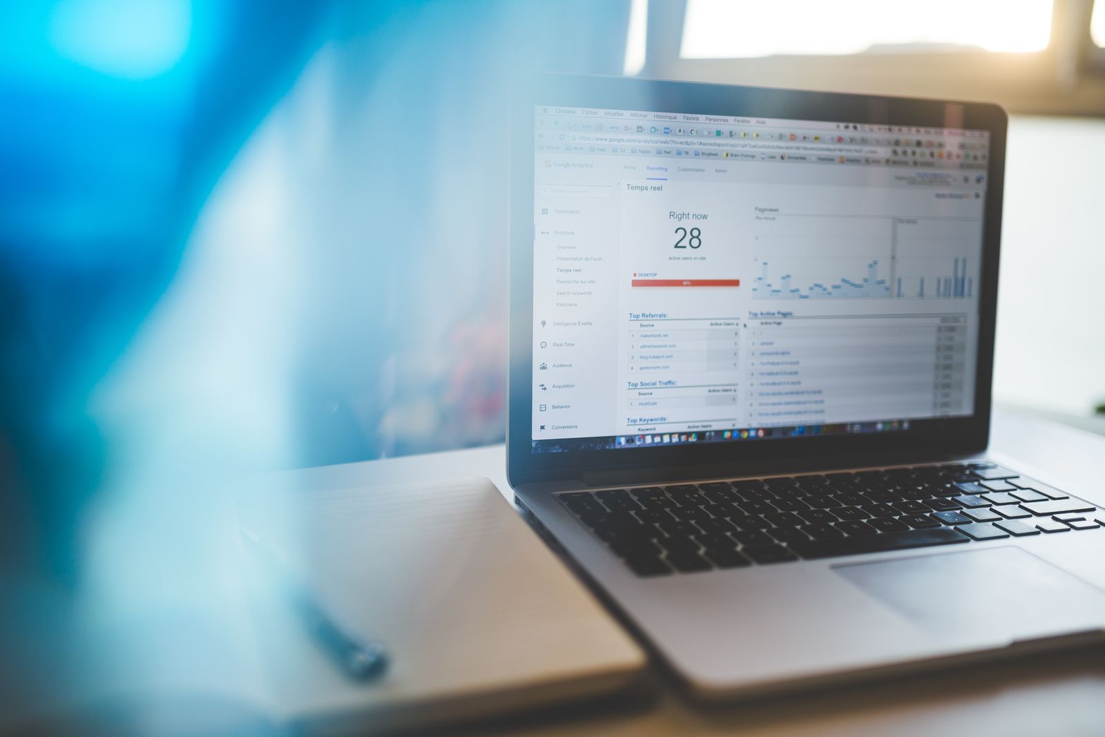 Business owner reviewing Google Analytics 4 reports on a laptop screen