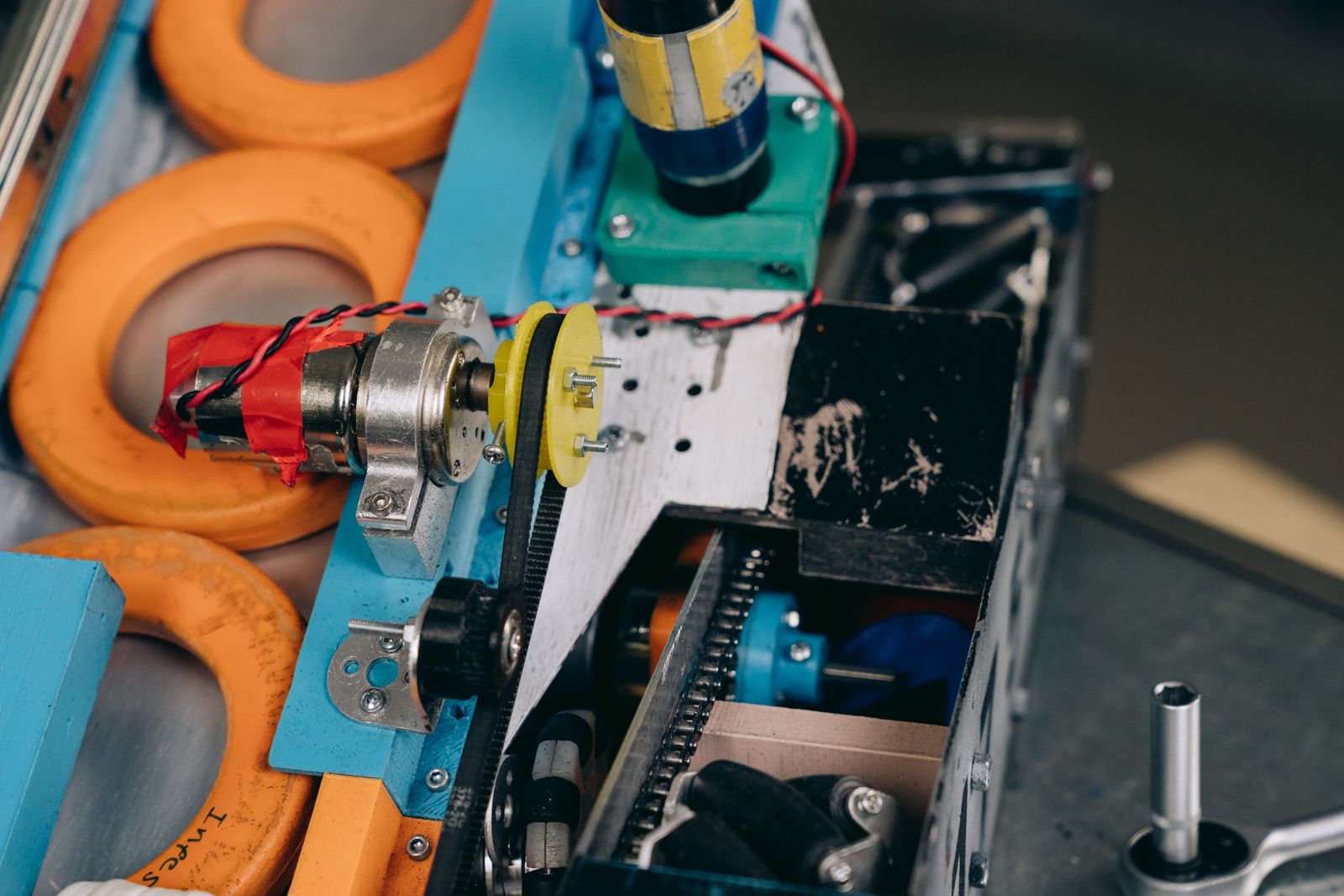 Close-up of machine gears meshing together, representing marketing automation for small business workflows