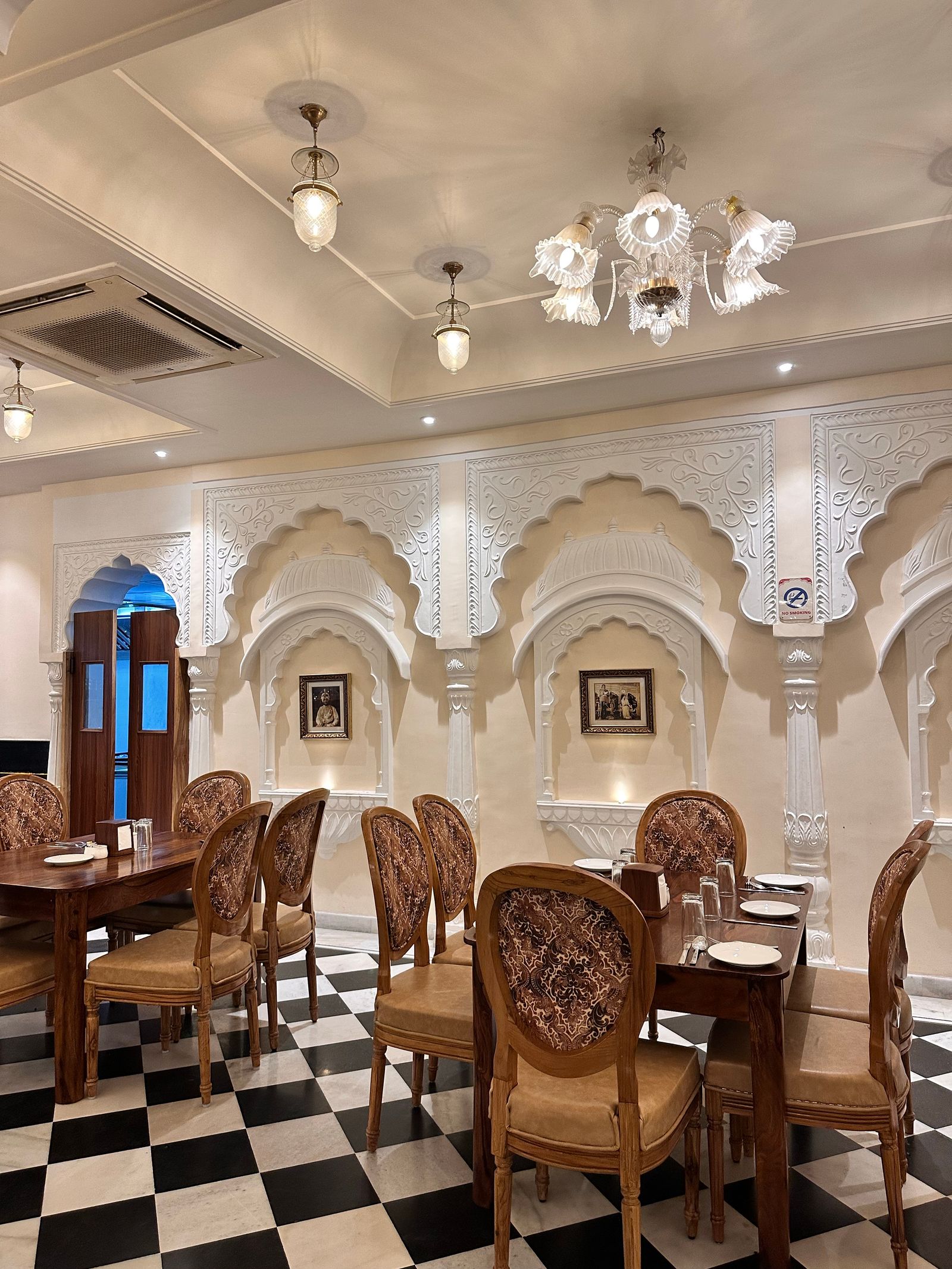 Warmly lit Indian restaurant interior with set tables, the kind of dine-in business local SEO for restaurants helps diners find on Google