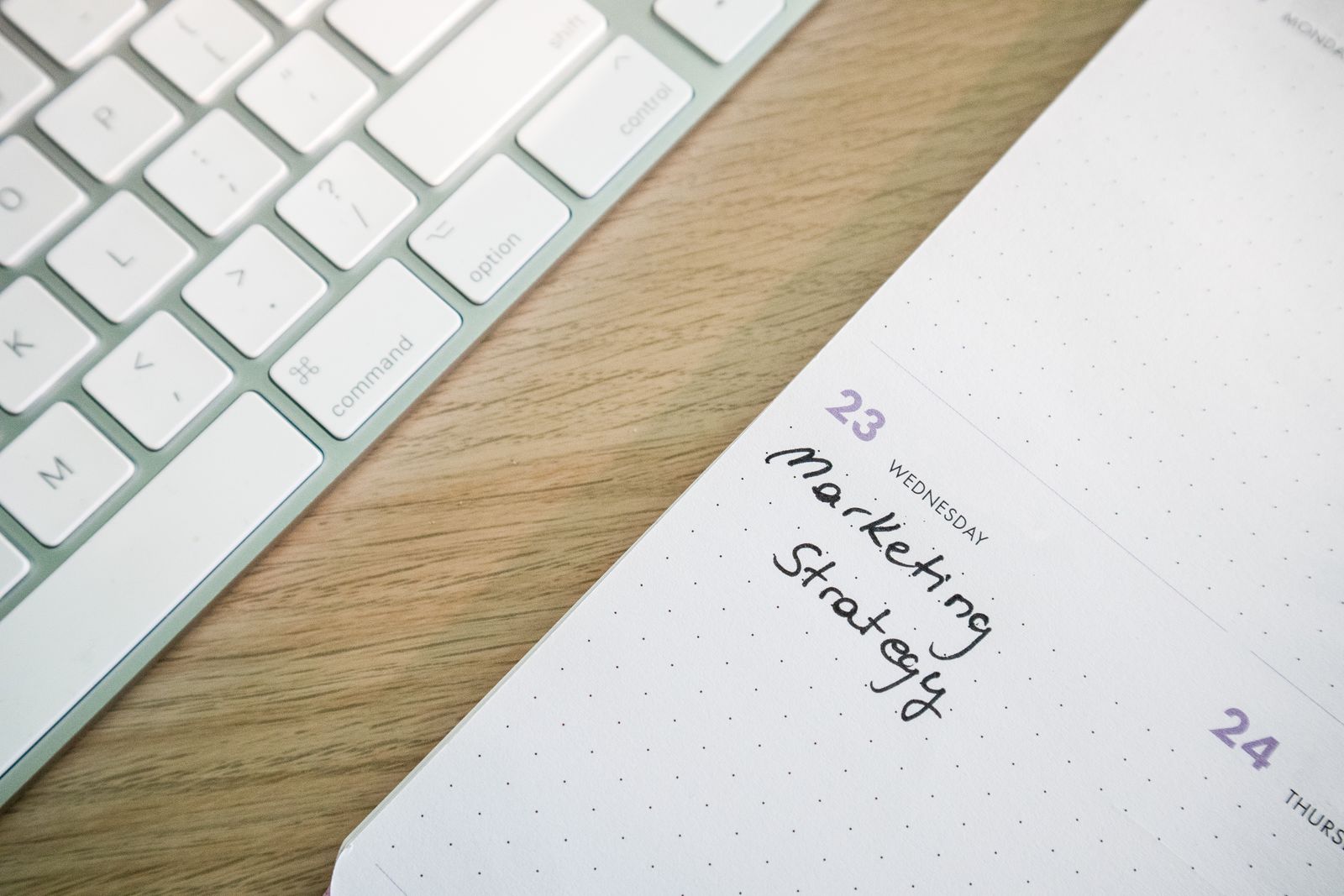 Planner and notes laid out on a desk to map a social media content calendar